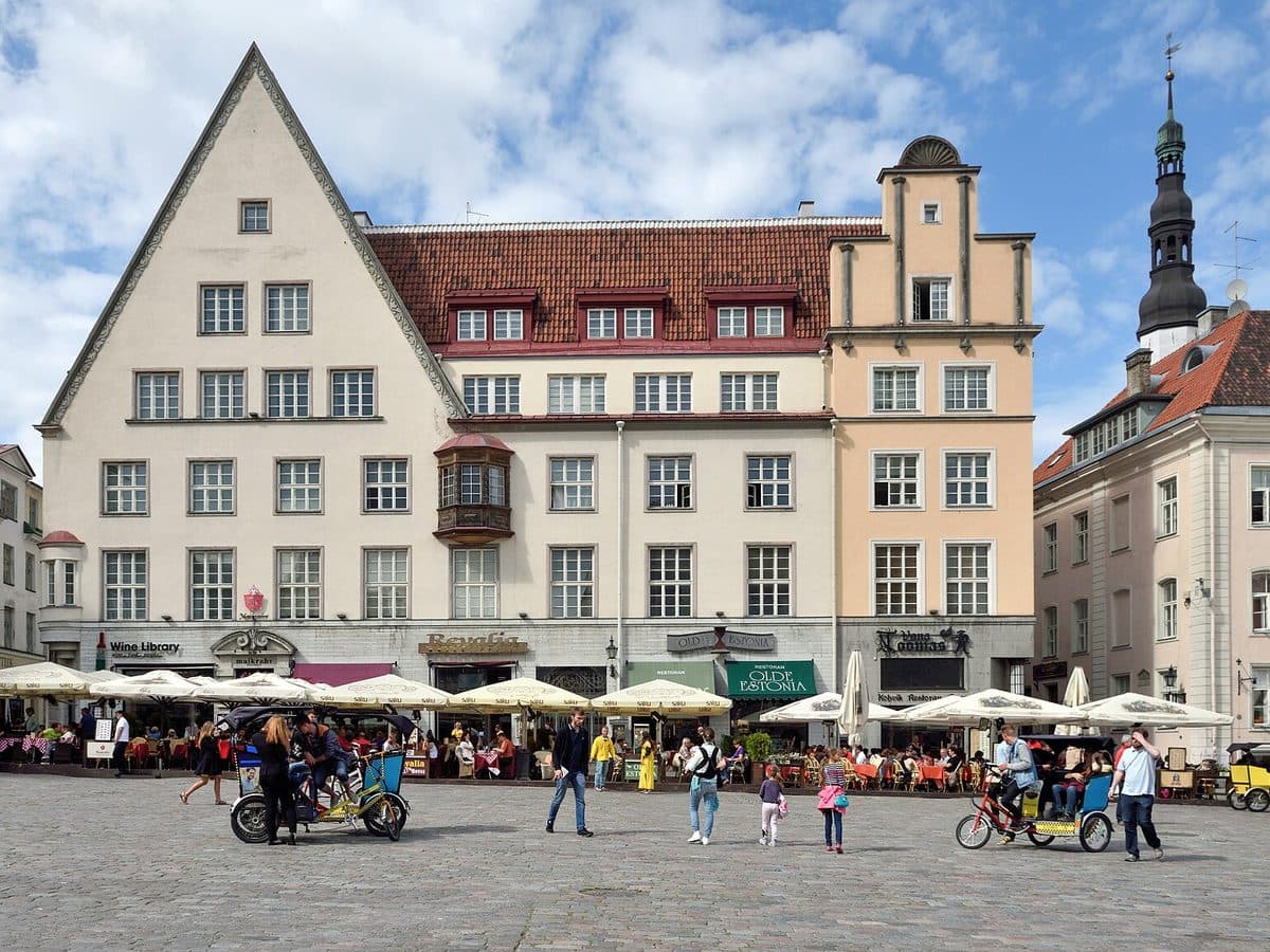 Gabled merchant houses and café awnings on Tallinn's Town Hall Square